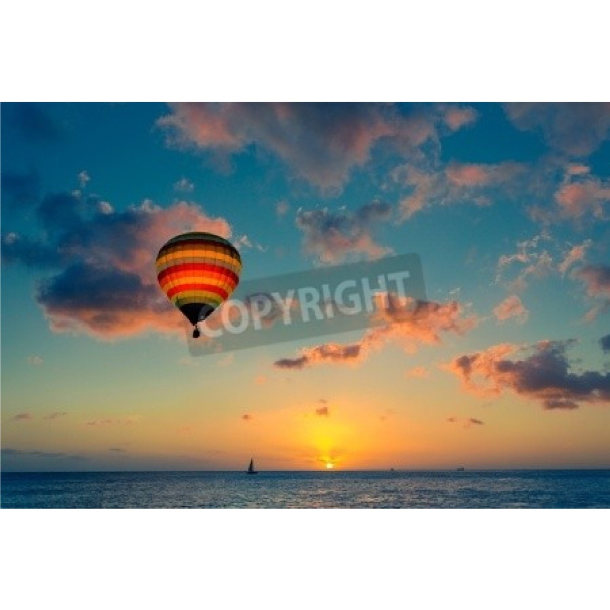 Hot air balloon with sunset at the sea background